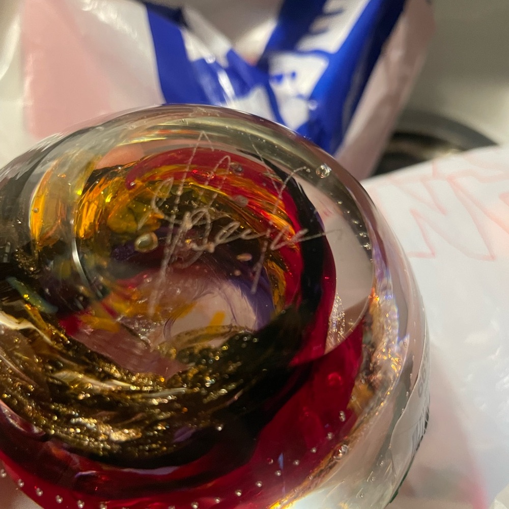 Artistic Glass Paperweight with Red and Gold Swirls